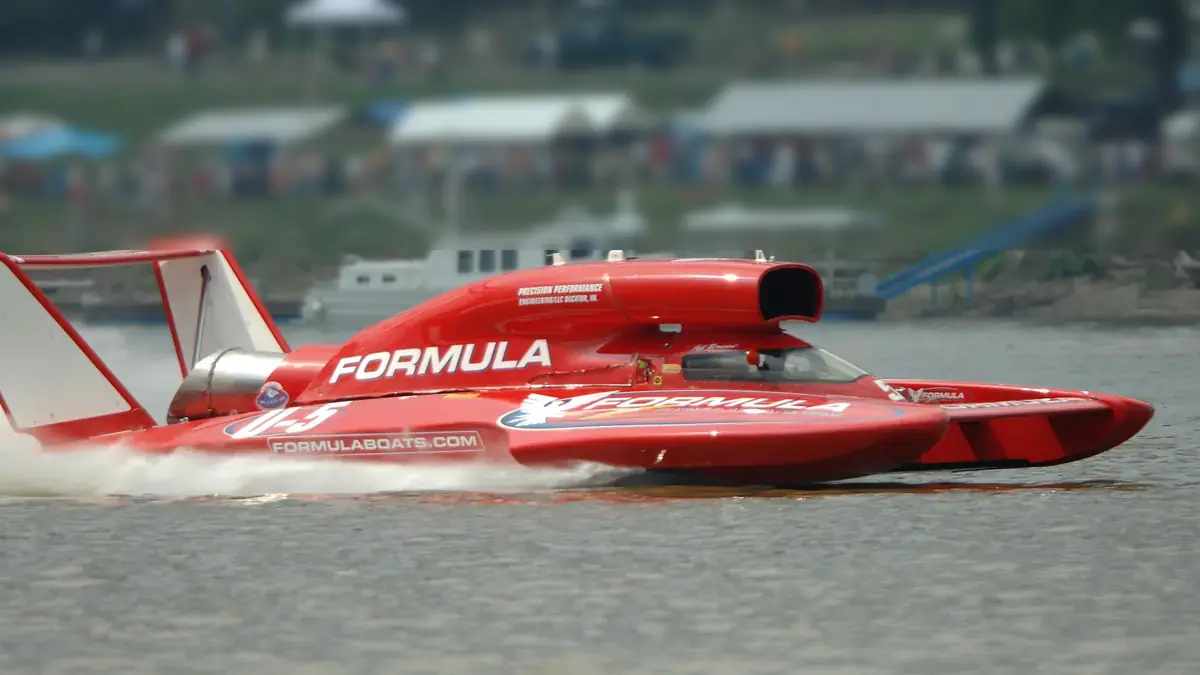 A red unlimited hydroplane racing on the Ohio River at the Madison Regatta