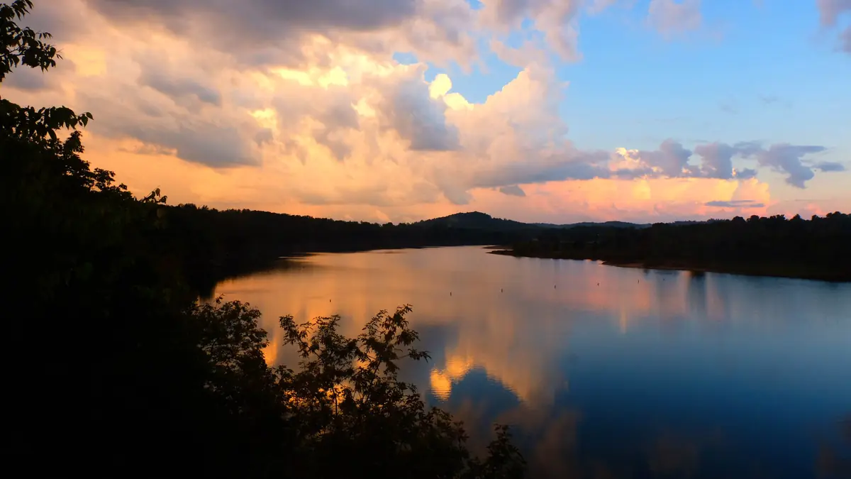 Rough River Lake at dusk with wooded hills reflected in calm water, Grayson County, Kentucky